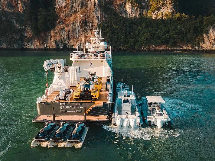 a boat carrying people on it aboard UMBRA Yacht for Sale