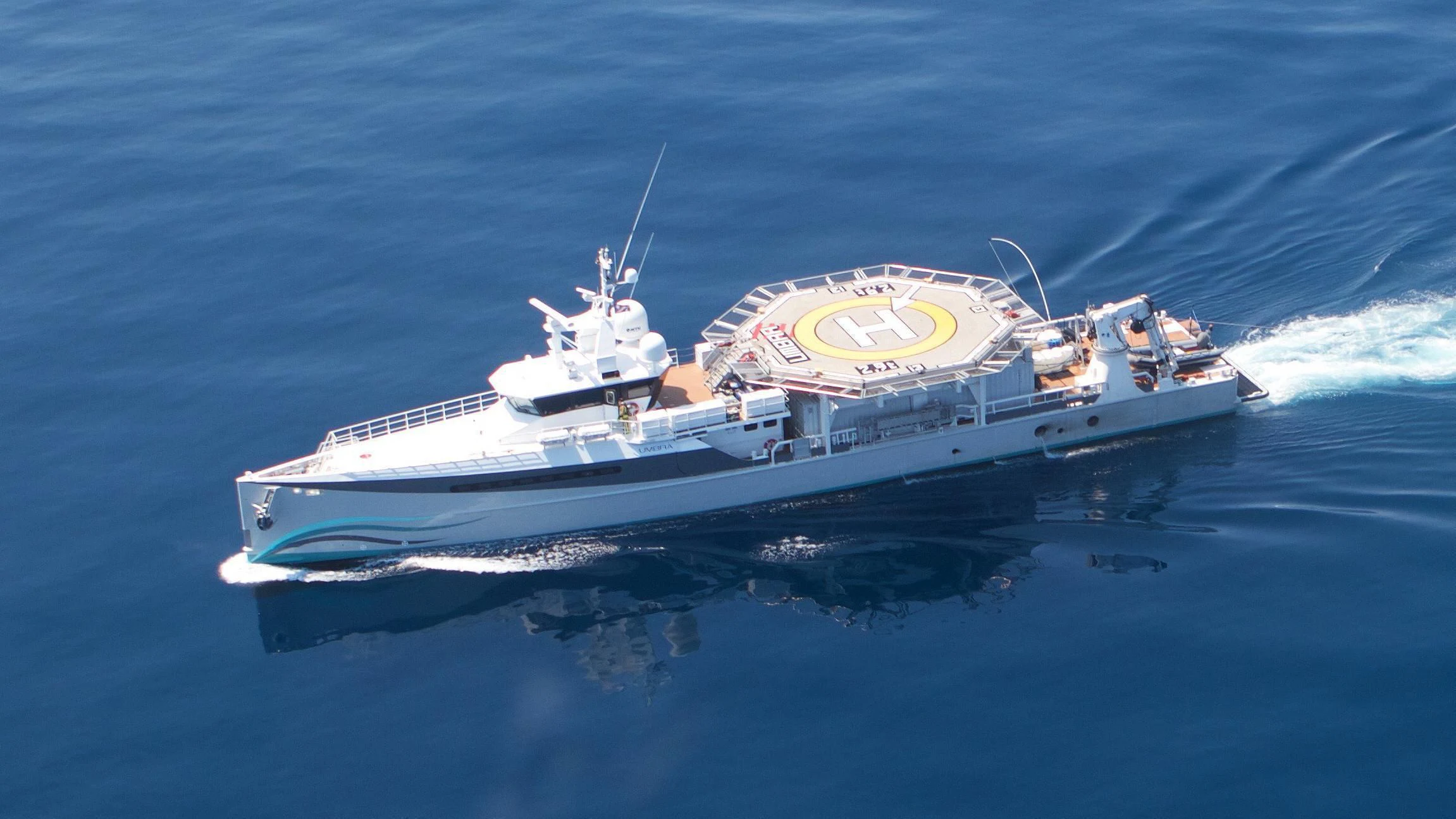 a large white boat in the water aboard UMBRA Yacht for Sale