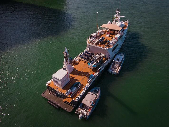 a large ship in the water aboard UMBRA Yacht for Sale