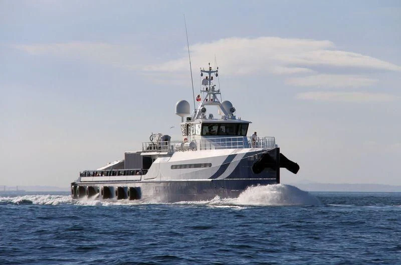 a large ship in the water aboard UMBRA Yacht for Sale
