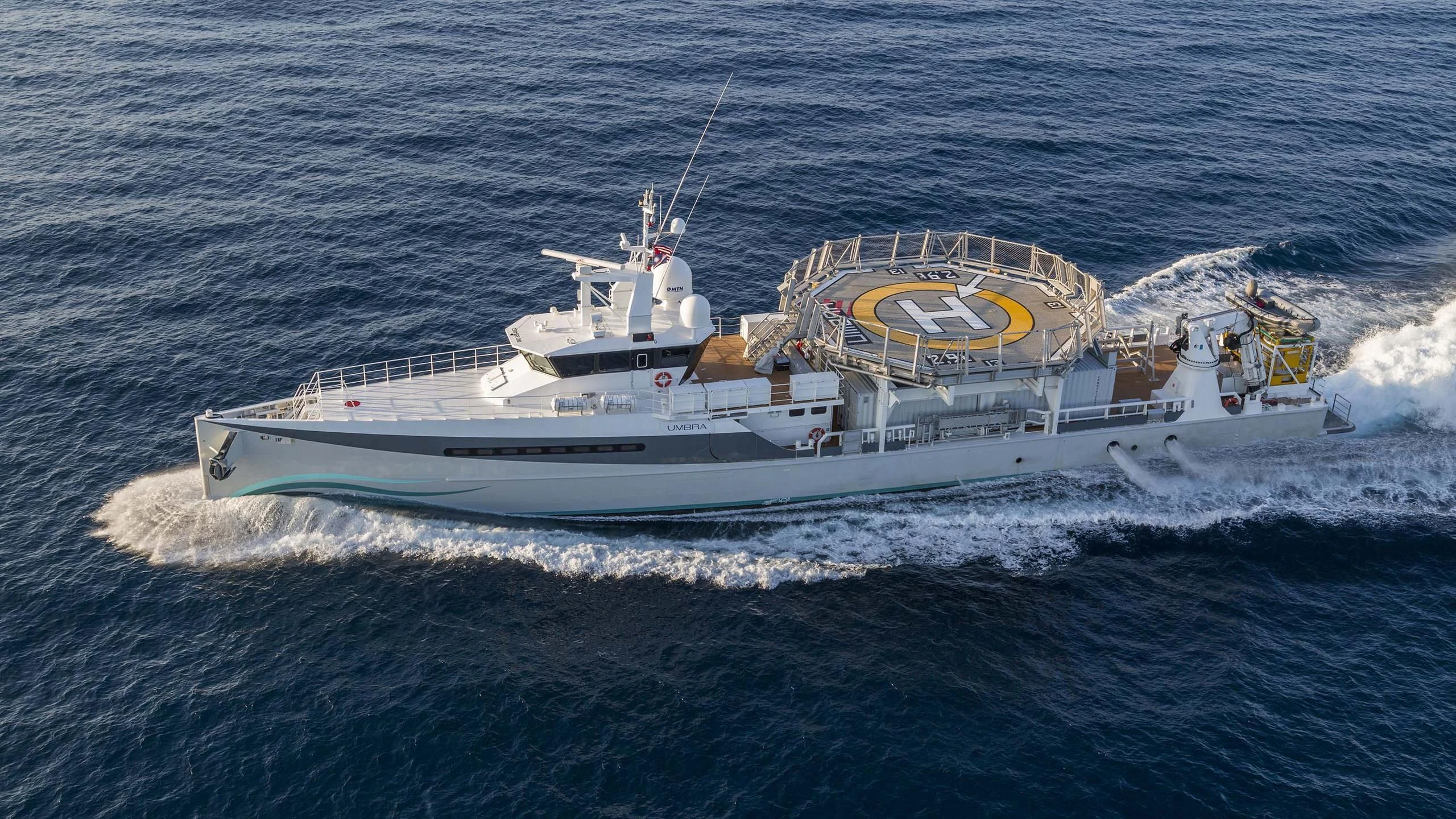 a large ship in the ocean aboard UMBRA Yacht for Sale