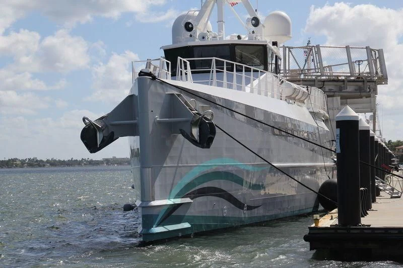a large ship in the water aboard UMBRA Yacht for Sale
