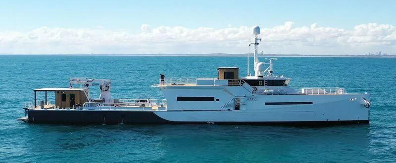 a large ship in the water aboard UMBRA Yacht for Sale
