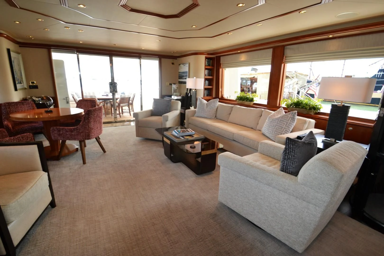 a living room with a couch and a table aboard INTUITION Yacht for Sale
