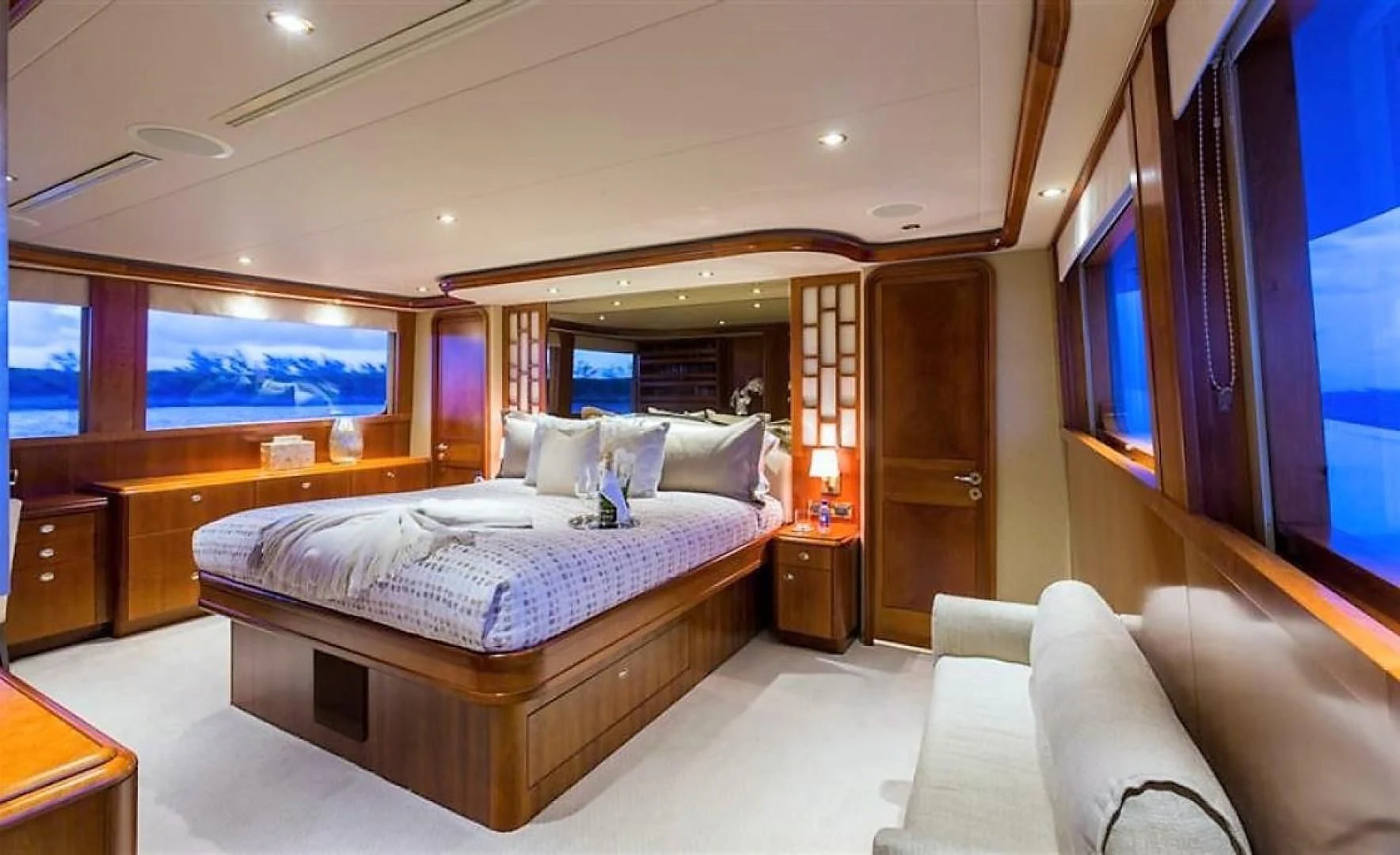 a bedroom with a large bed aboard INTUITION Yacht for Sale
