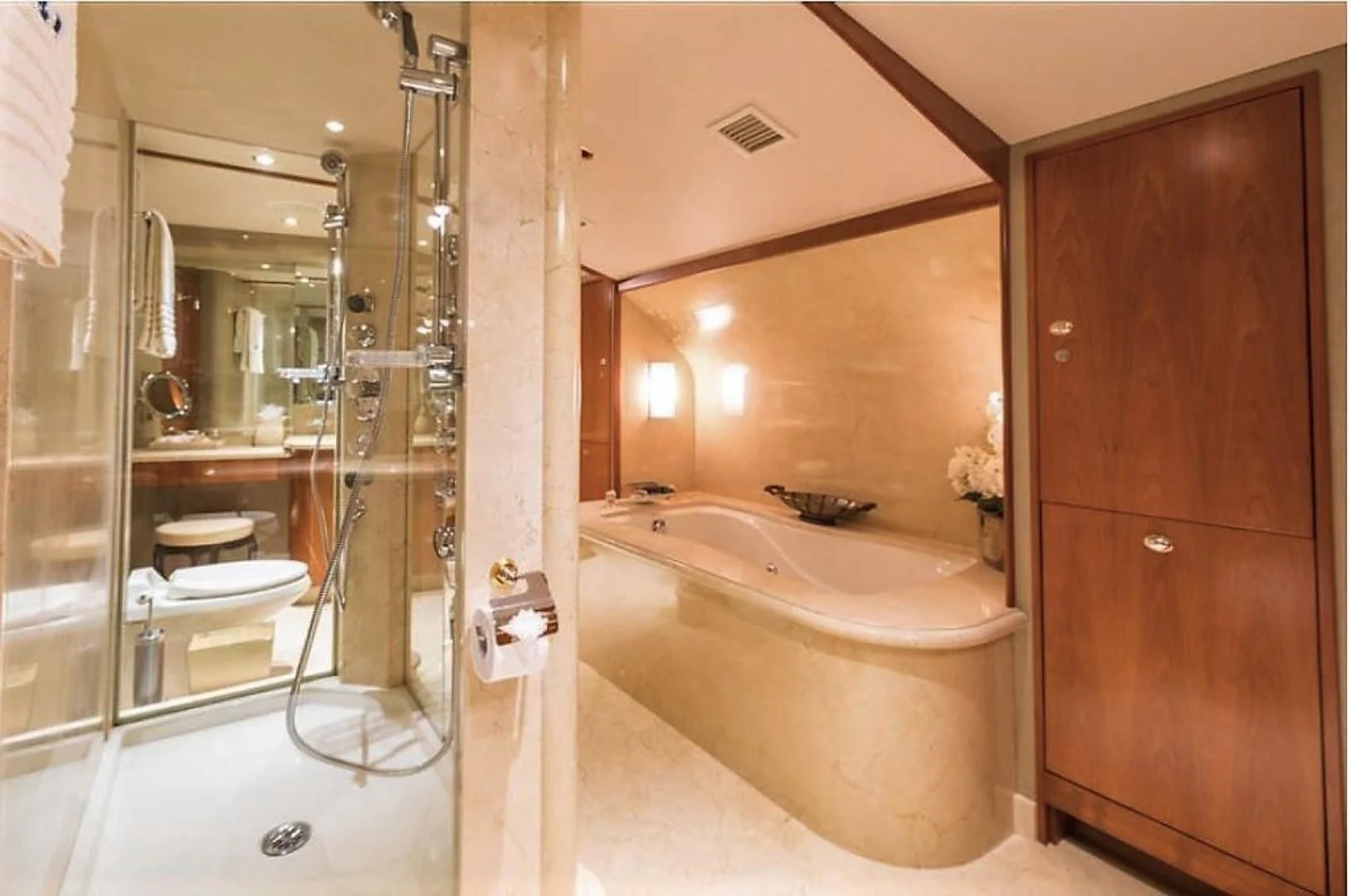 a bathroom with a bathtub and shower aboard INTUITION Yacht for Sale