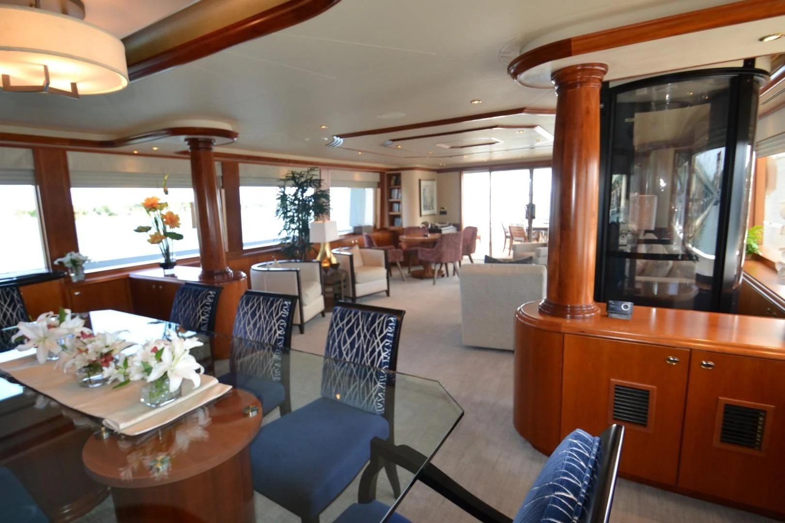 a dining room with a large mirror aboard INTUITION Yacht for Sale