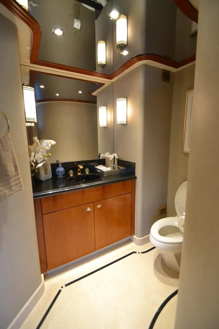 a bathroom with a sink and toilet aboard INTUITION Yacht for Sale