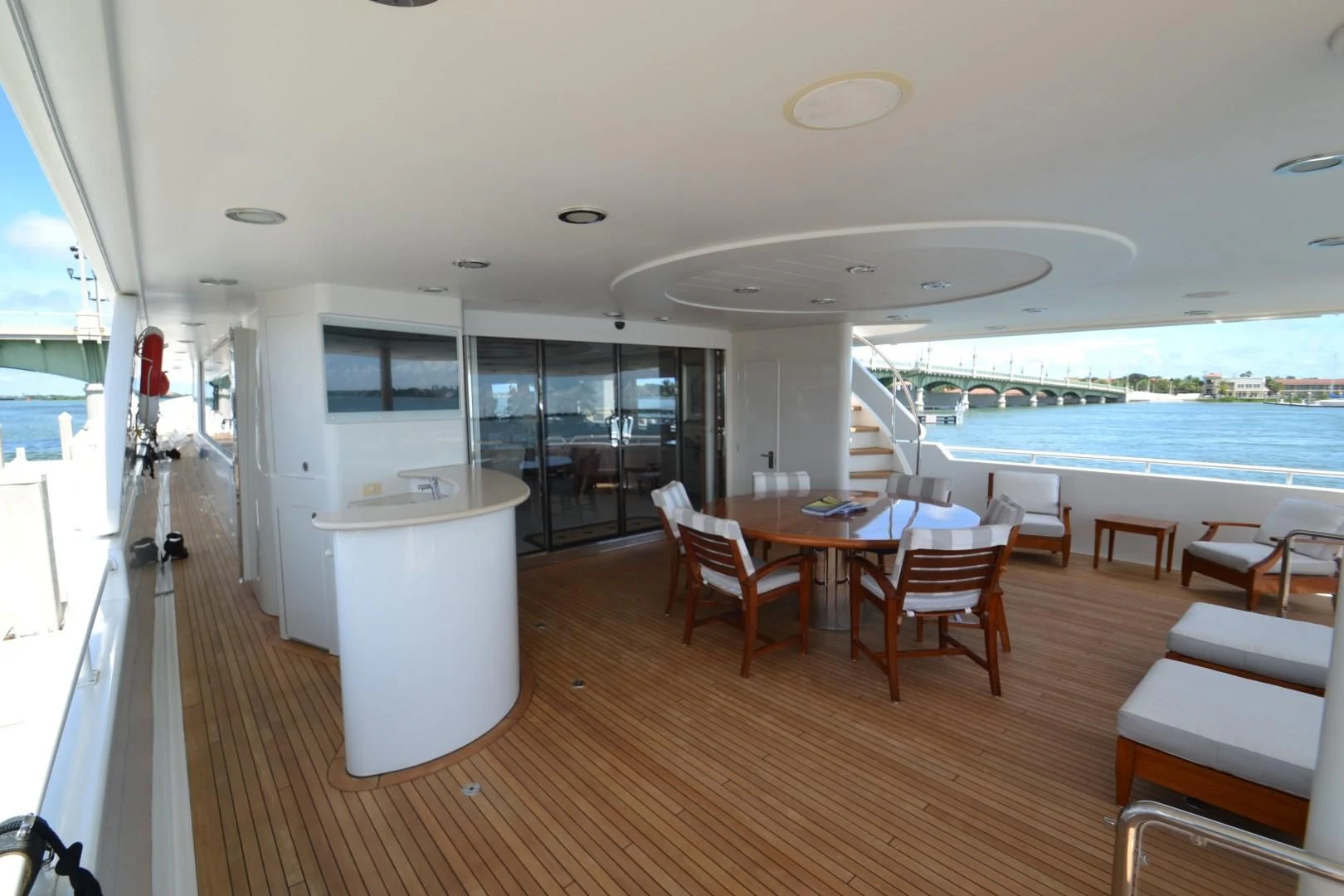 a room with a table chairs and a large window aboard INTUITION Yacht for Sale