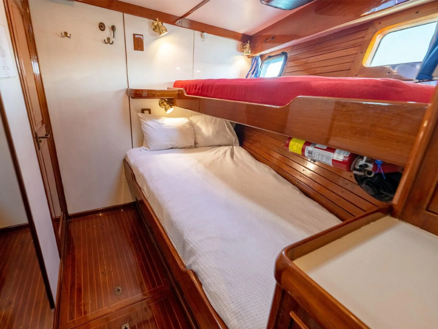 a bed in a room aboard HERMIE LOUISE Yacht for Sale