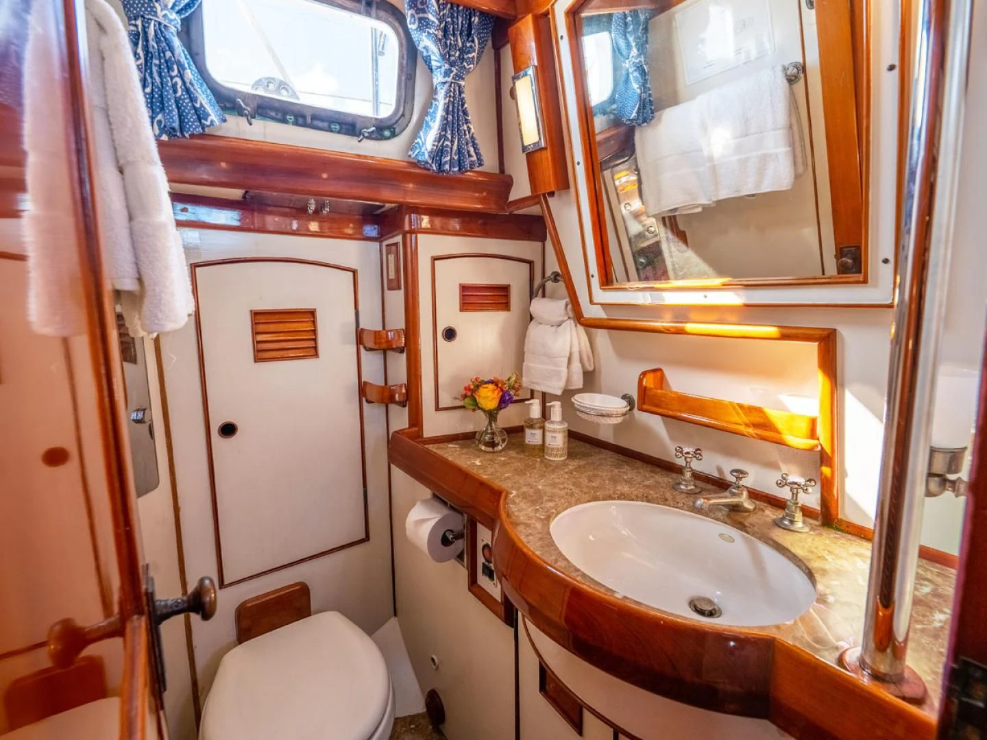 a bathroom with a sink and toilet aboard HERMIE LOUISE Yacht for Sale