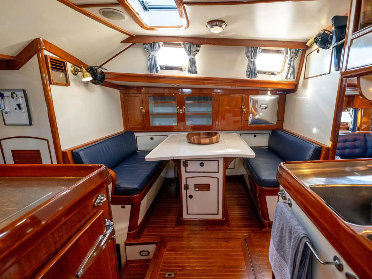 a room with a table and chairs aboard HERMIE LOUISE Yacht for Sale