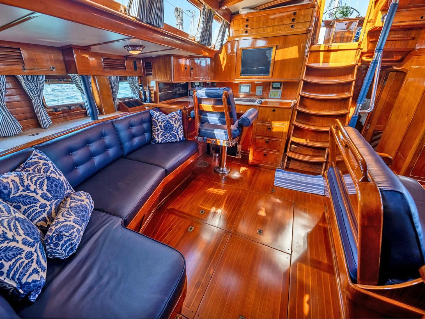 a large cabin with a wood floor aboard HERMIE LOUISE Yacht for Sale