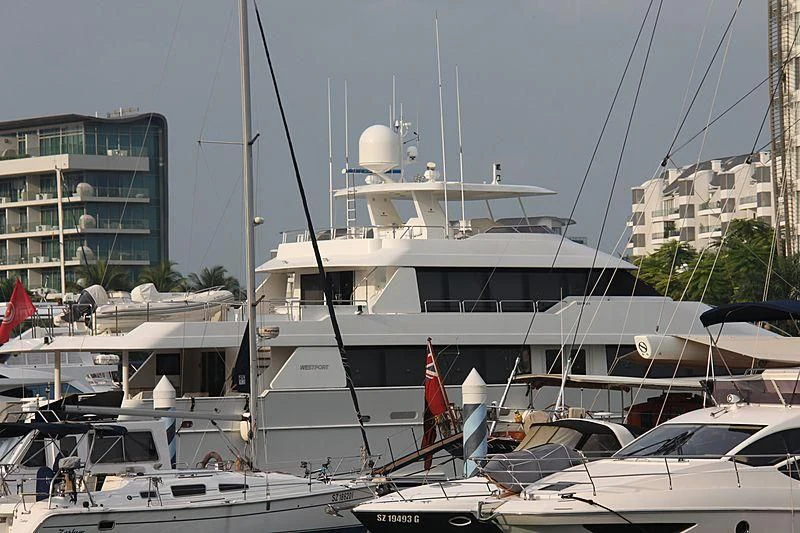 a large white boat in a harbor aboard SEA BEAR Yacht for Sale