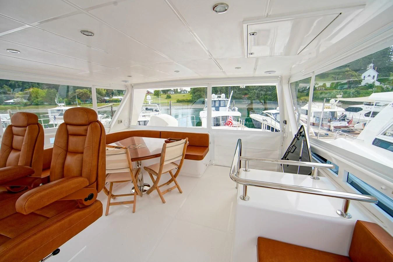 inside of a building with tables and chairs aboard KING OF NOTHING Yacht for Sale
