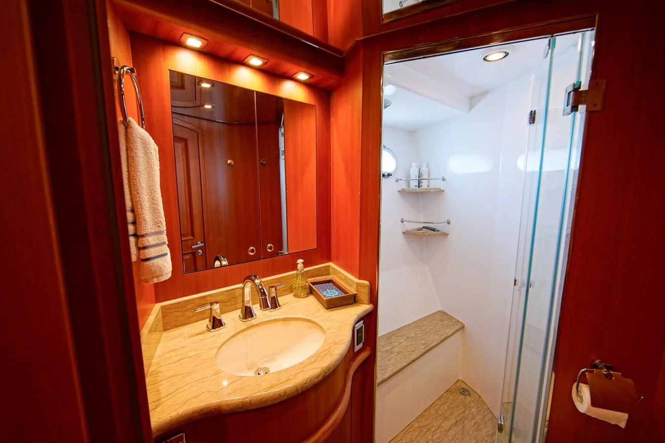 a bathroom with a sink and mirror aboard KING OF NOTHING Yacht for Sale