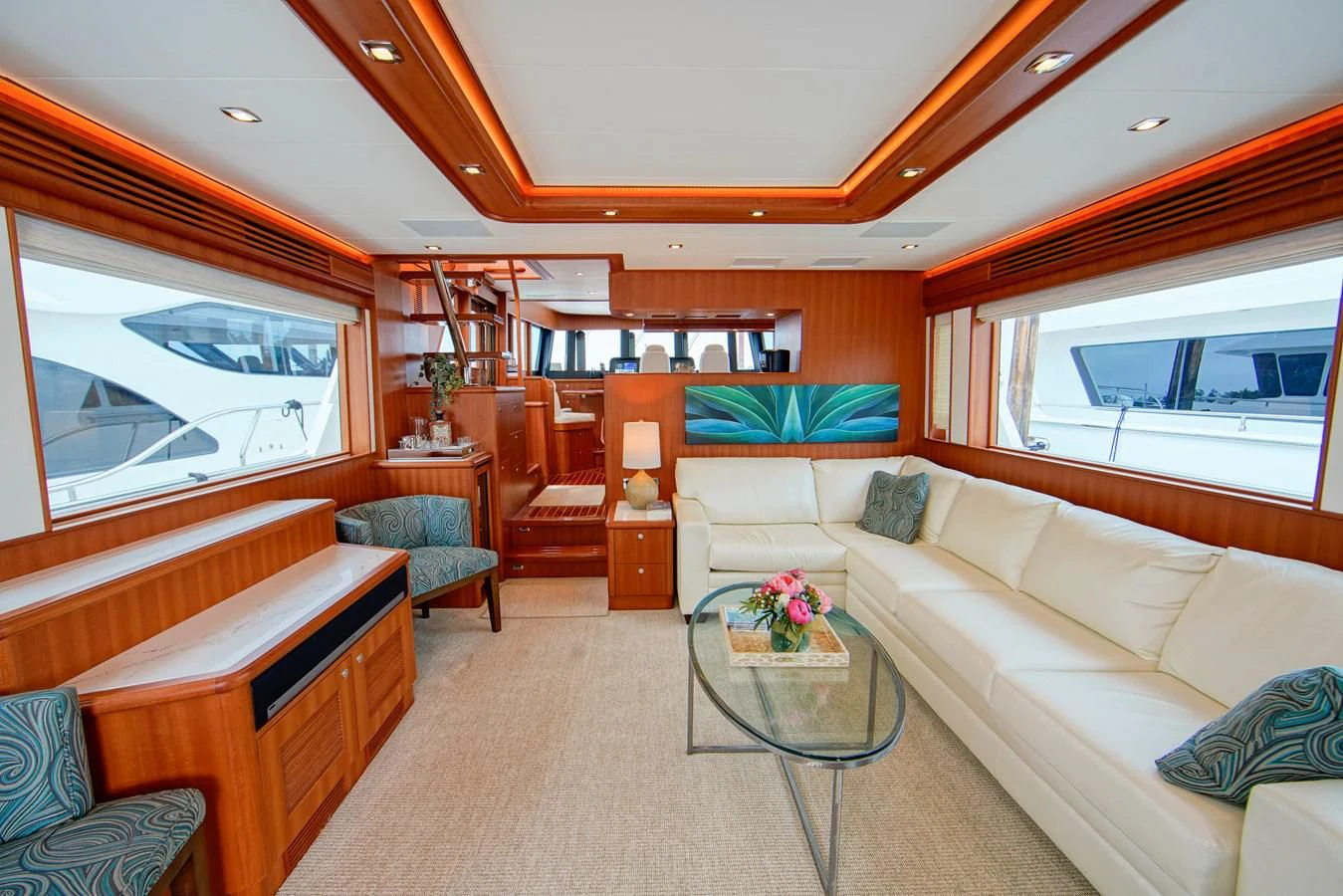 a living room with a large window aboard KING OF NOTHING Yacht for Sale