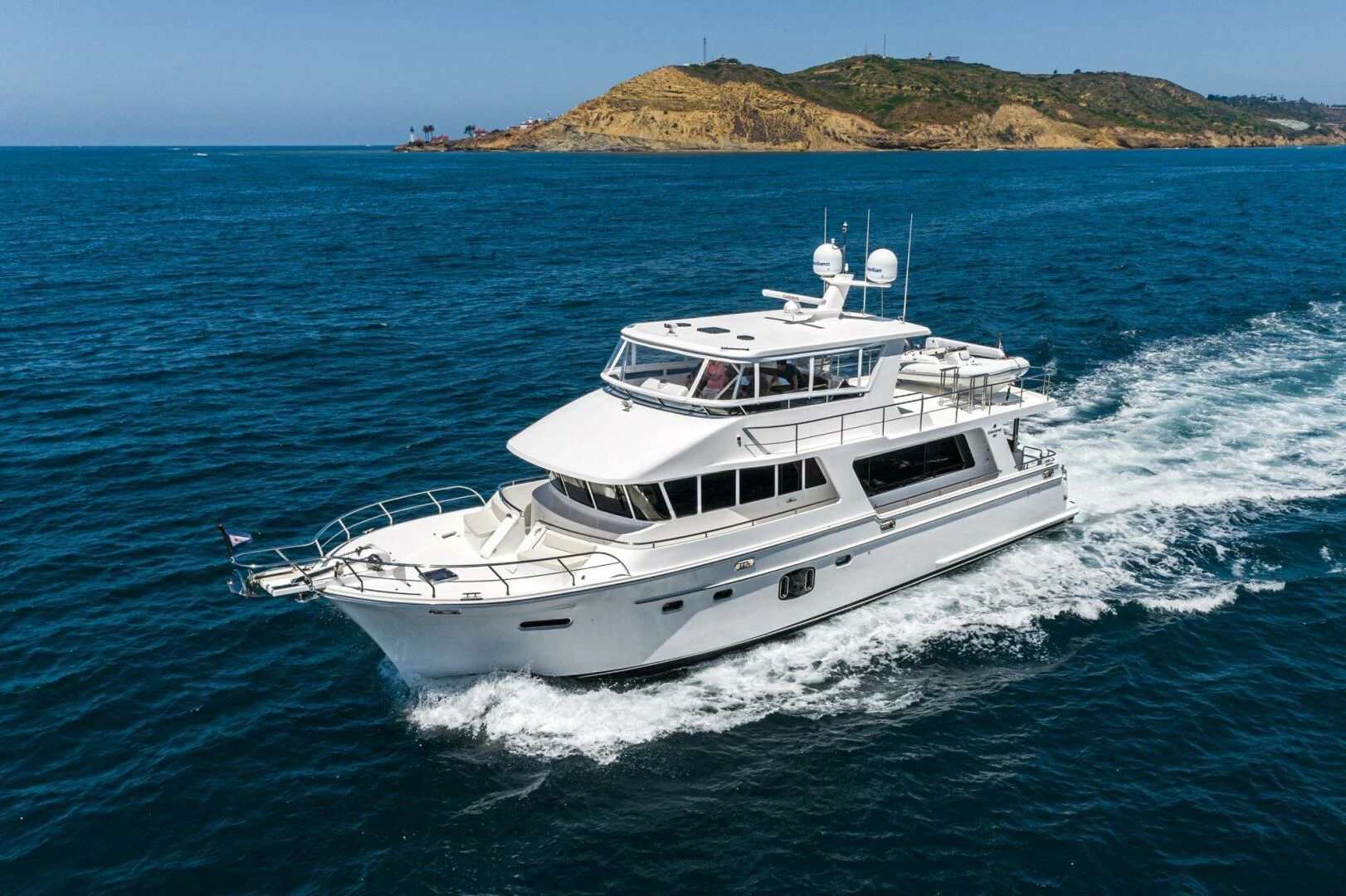 a white boat on the water aboard KING OF NOTHING Yacht for Sale