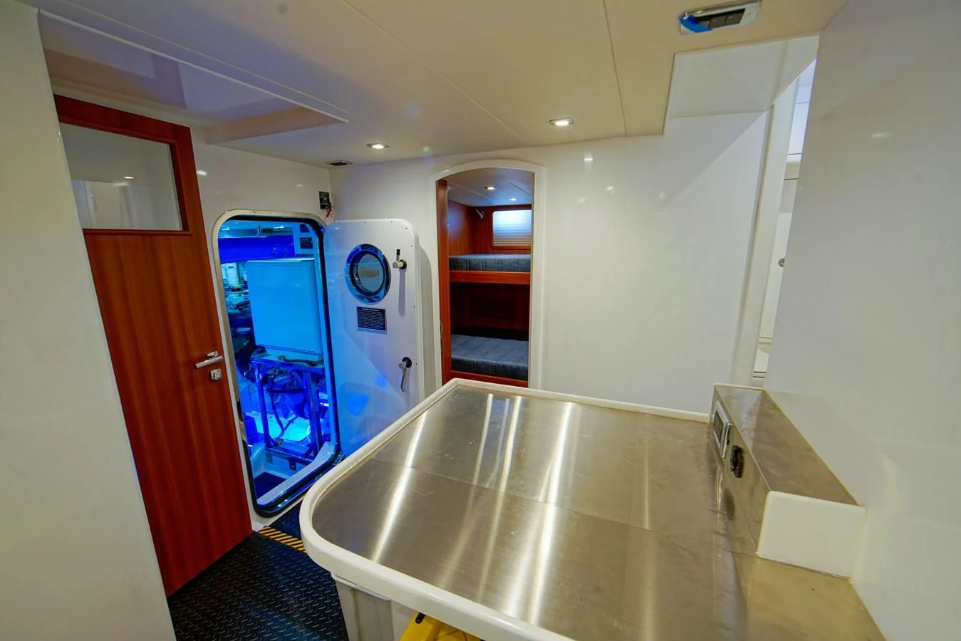a kitchen with a sink and a large mirror aboard KING OF NOTHING Yacht for Sale