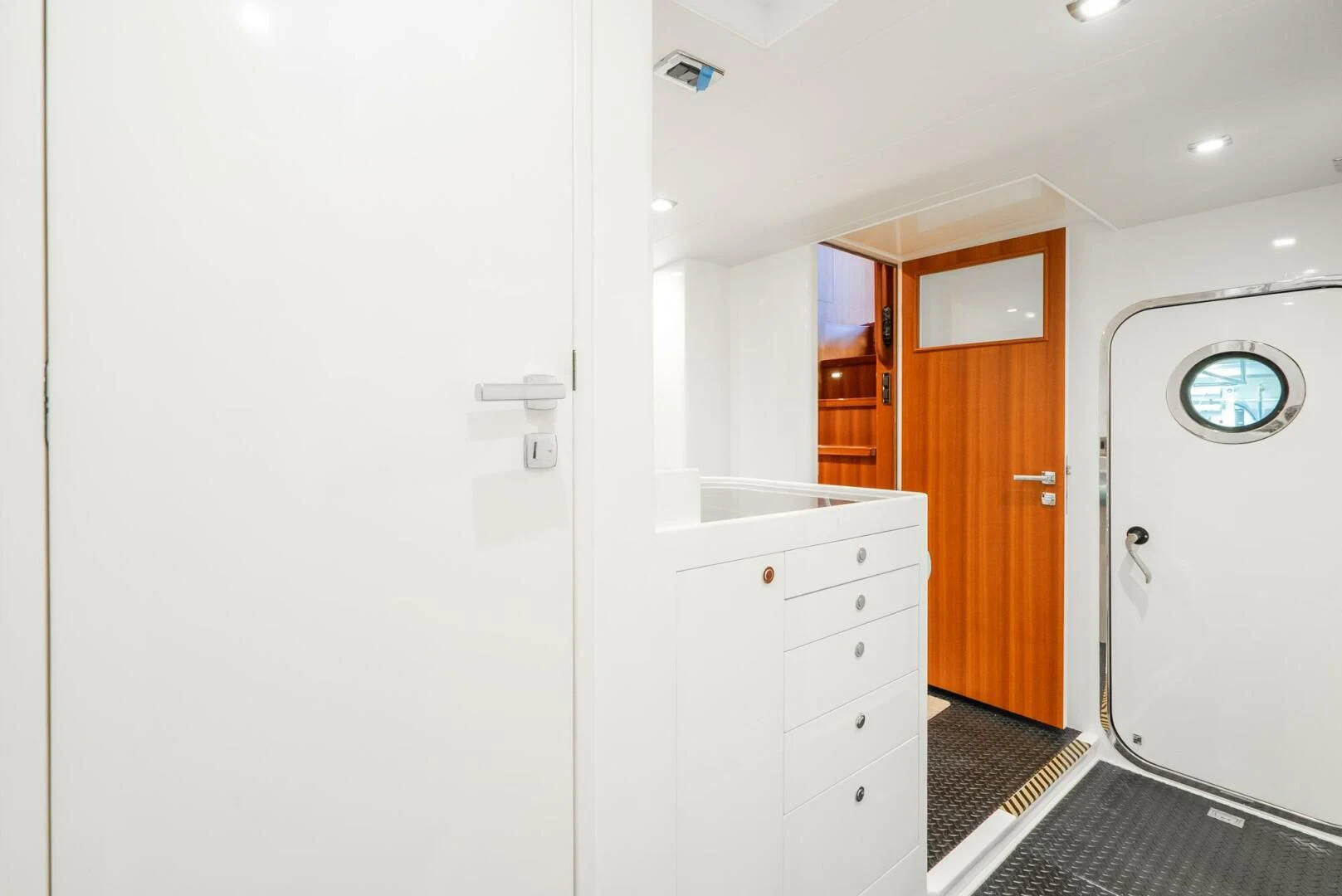 a white bathroom with a black and white tile floor aboard KING OF NOTHING Yacht for Sale