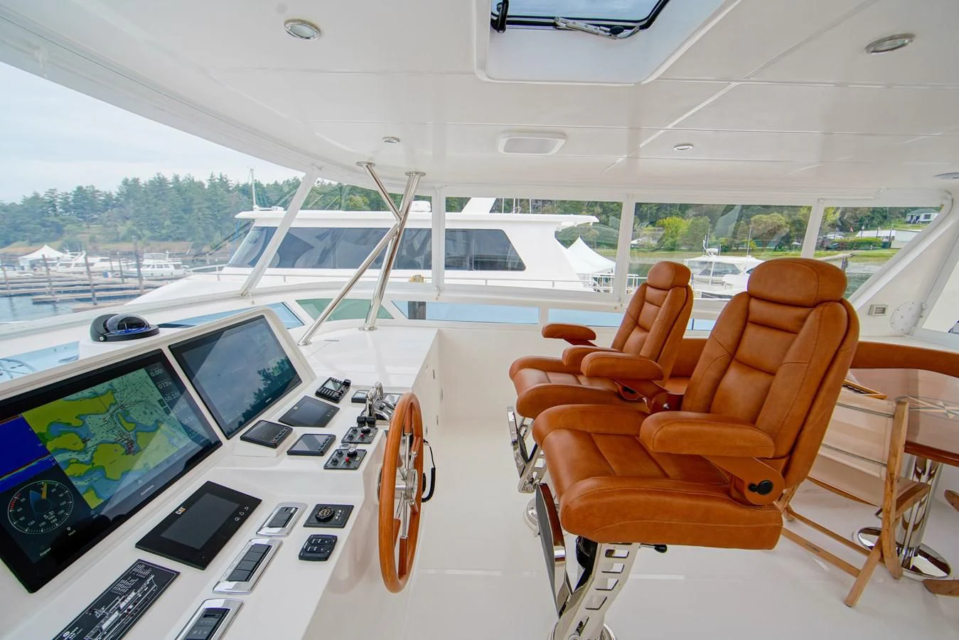 a room with a table and chairs aboard KING OF NOTHING Yacht for Sale