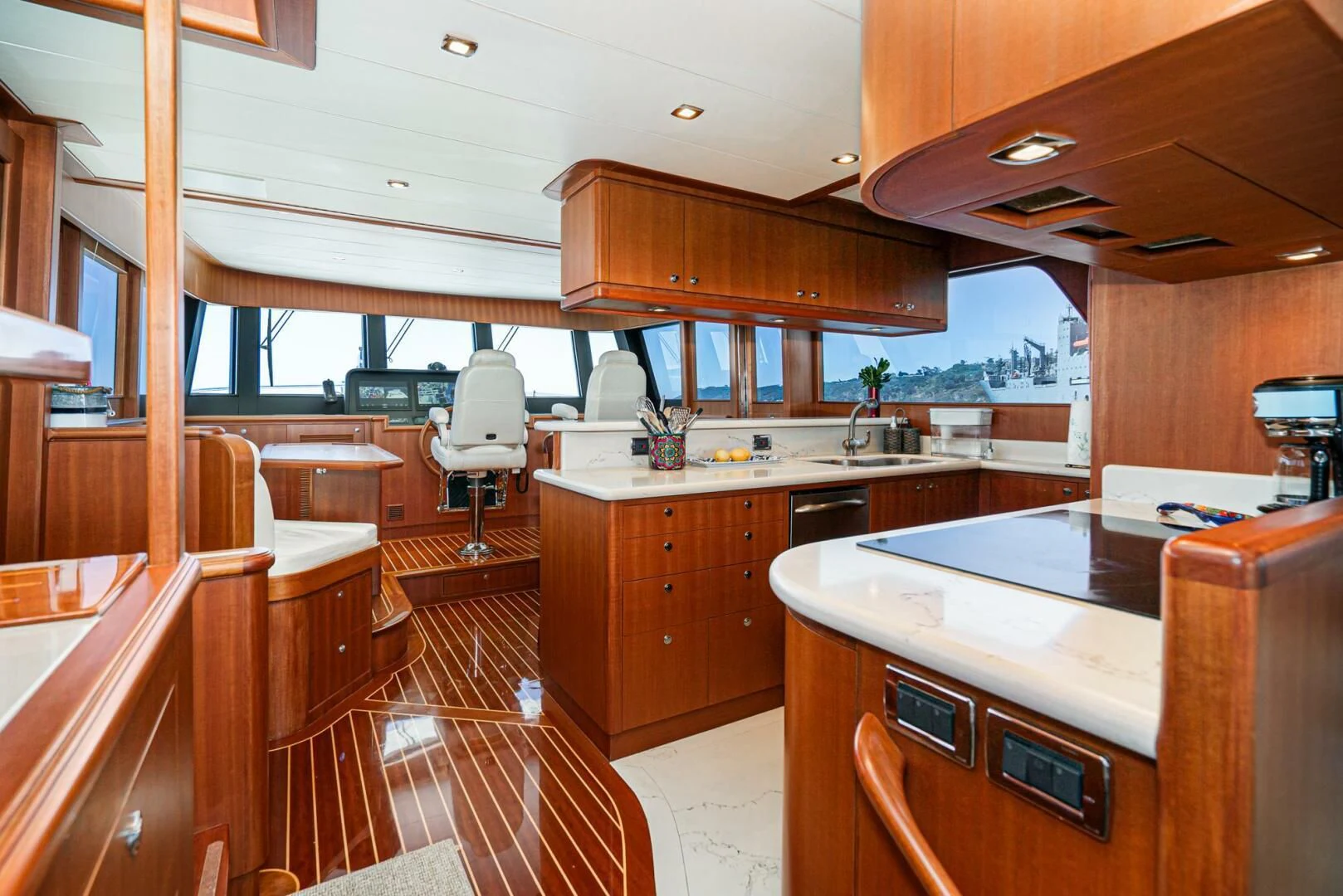 a kitchen with wooden cabinets aboard KING OF NOTHING Yacht for Sale