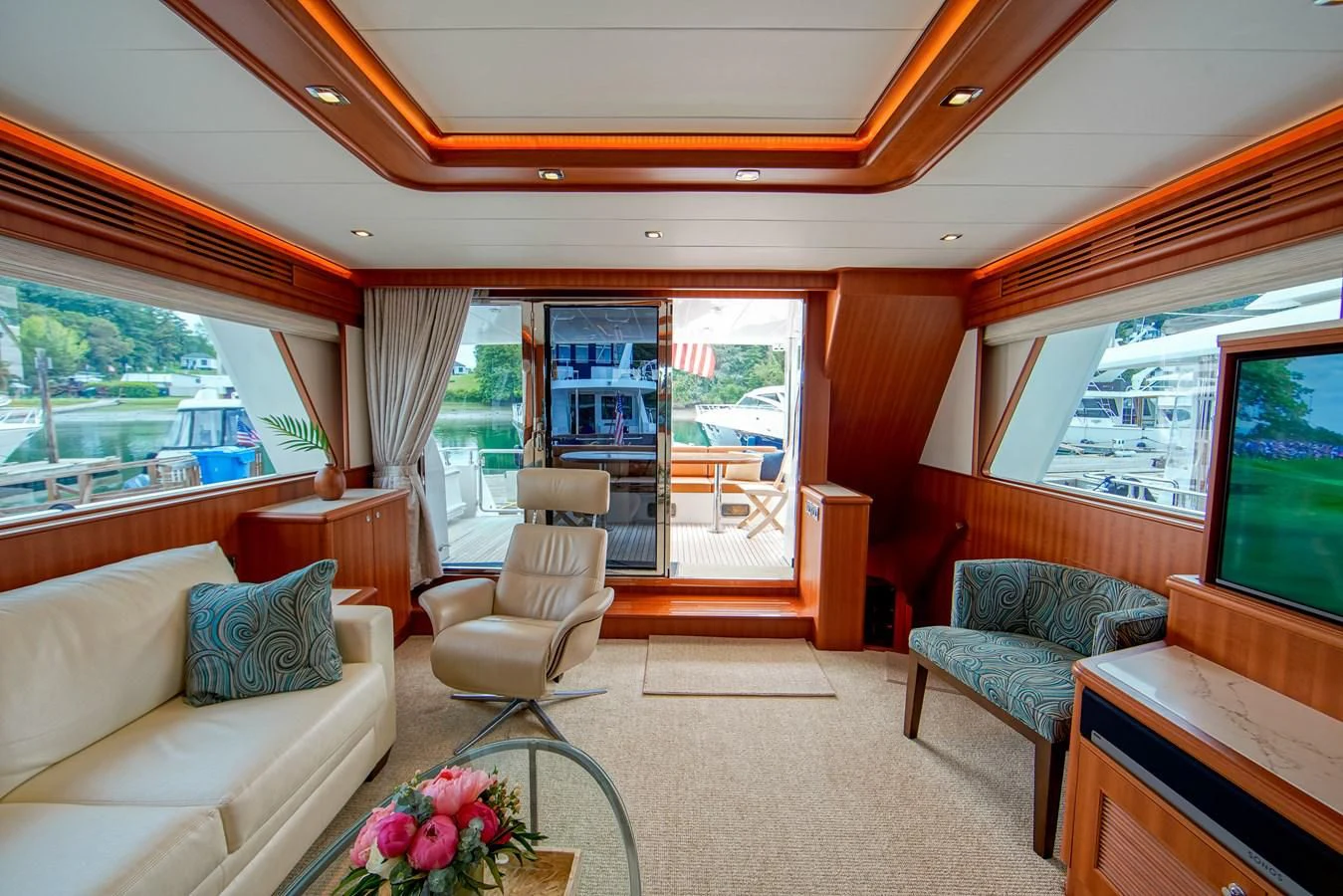a living room with a large window aboard KING OF NOTHING Yacht for Sale