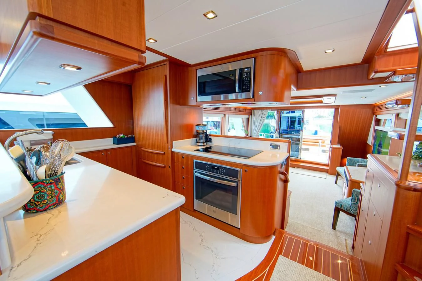 a kitchen with wooden cabinets aboard KING OF NOTHING Yacht for Sale