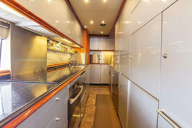 a kitchen with stainless steel appliances aboard #OMG Yacht for Sale