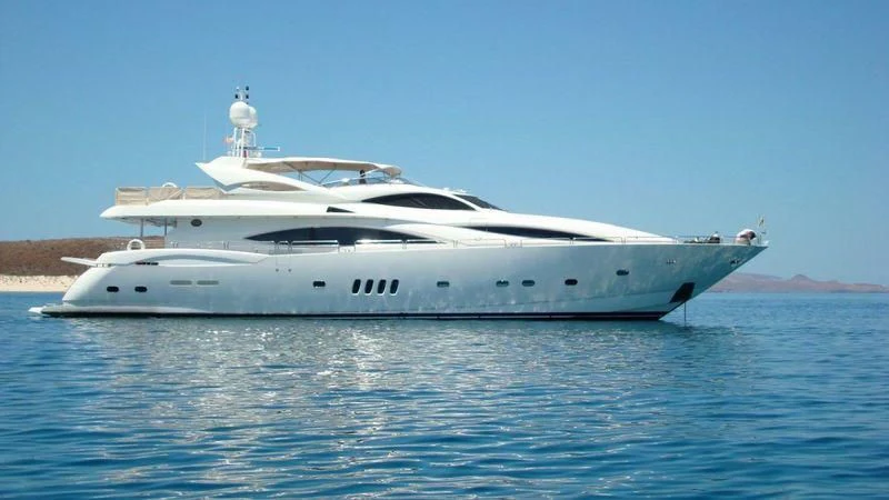 a white yacht in the water aboard #OMG Yacht for Sale