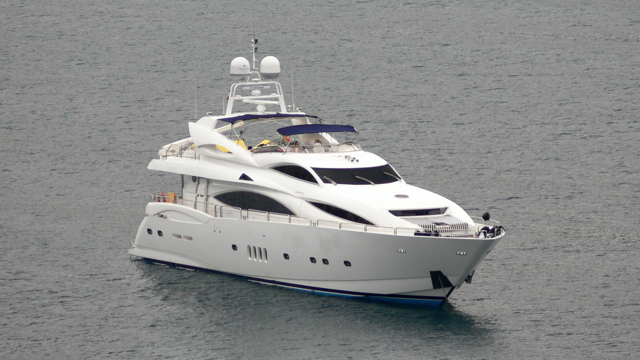 a white yacht on the water aboard #OMG Yacht for Sale