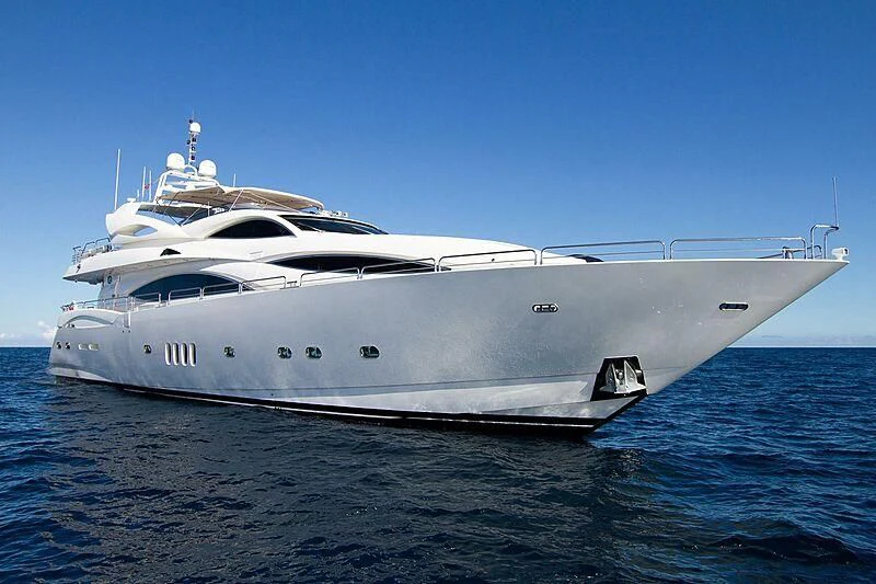 a white yacht in the water aboard #OMG Yacht for Sale