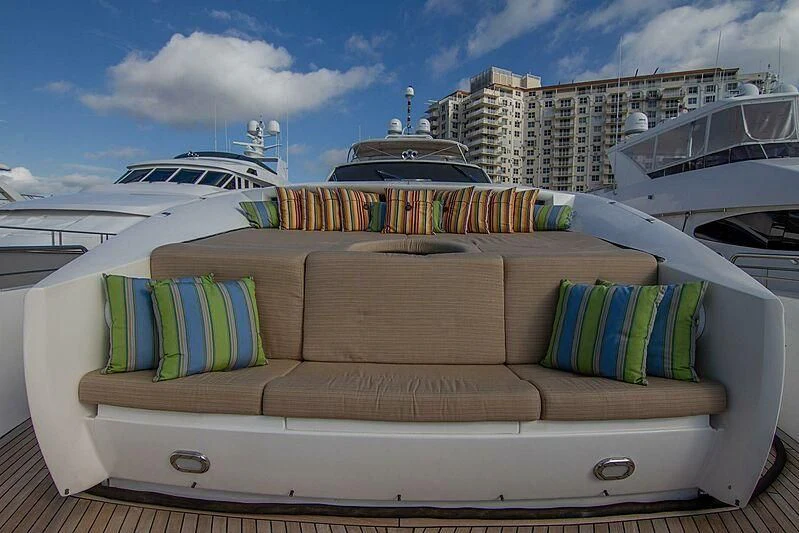 a couch on a deck aboard #OMG Yacht for Sale