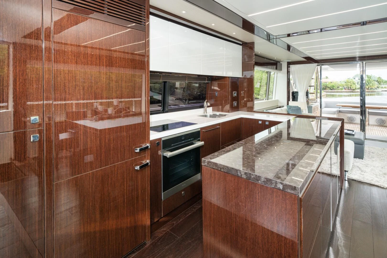 a kitchen with a large wooden cabinet aboard TEMPUS FUGIT Yacht for Sale