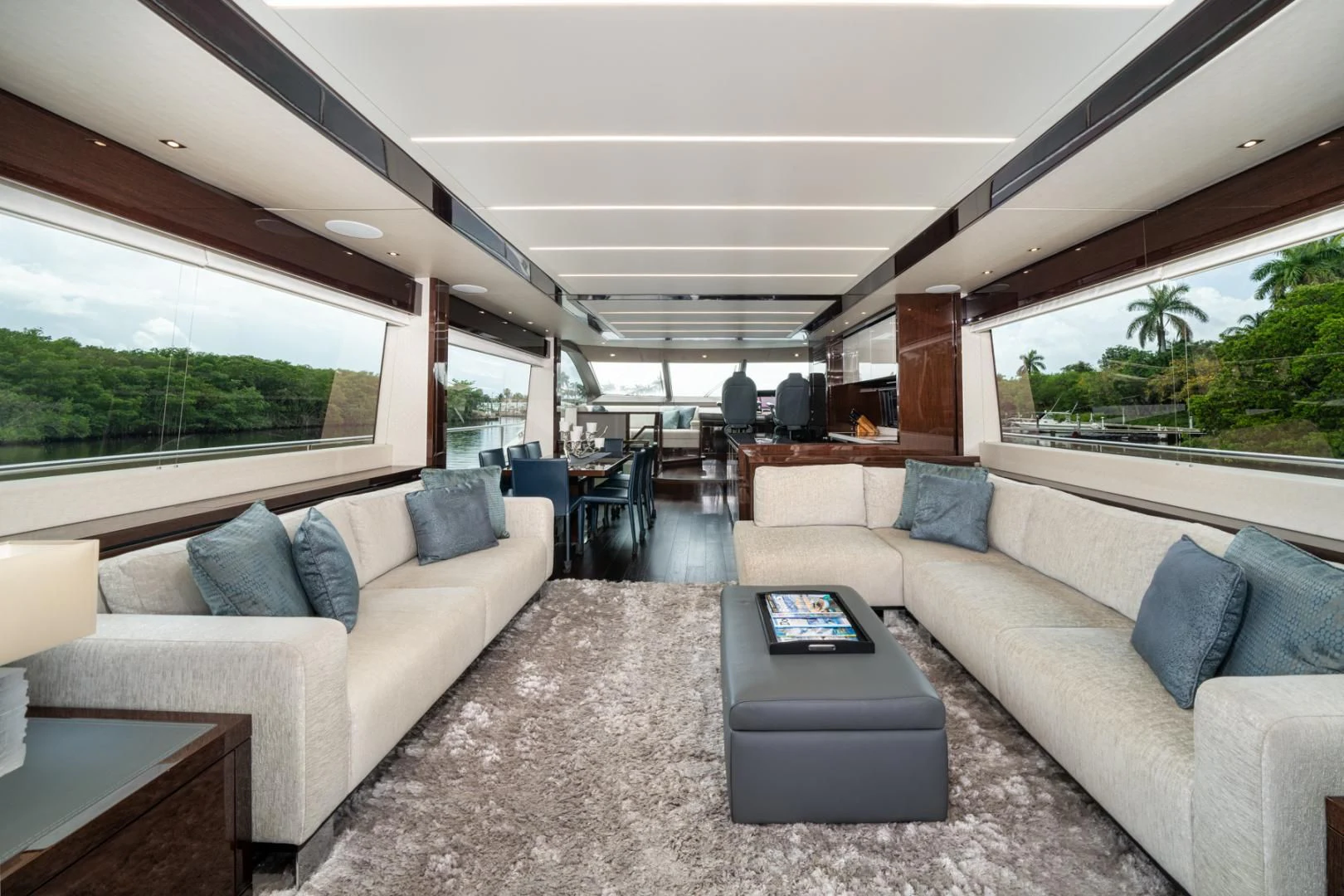 a living room with couches and a table aboard TEMPUS FUGIT Yacht for Sale