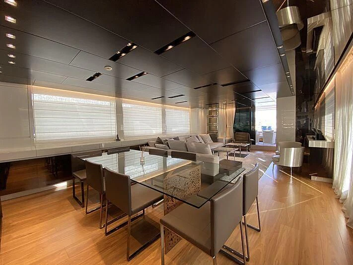 a room with a table and chairs aboard THE PHAT BOAT Yacht for Sale