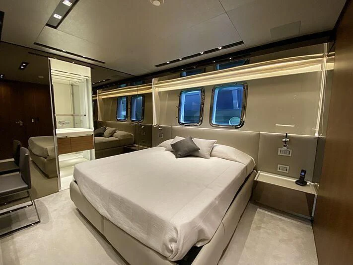 a room with a bed and a couch aboard THE PHAT BOAT Yacht for Sale