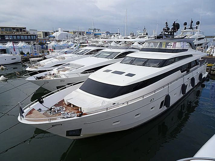 a large white yacht in a harbor aboard THE PHAT BOAT Yacht for Sale