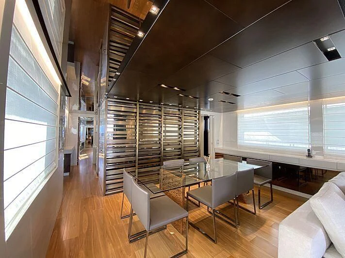 a room with a table and chairs aboard THE PHAT BOAT Yacht for Sale
