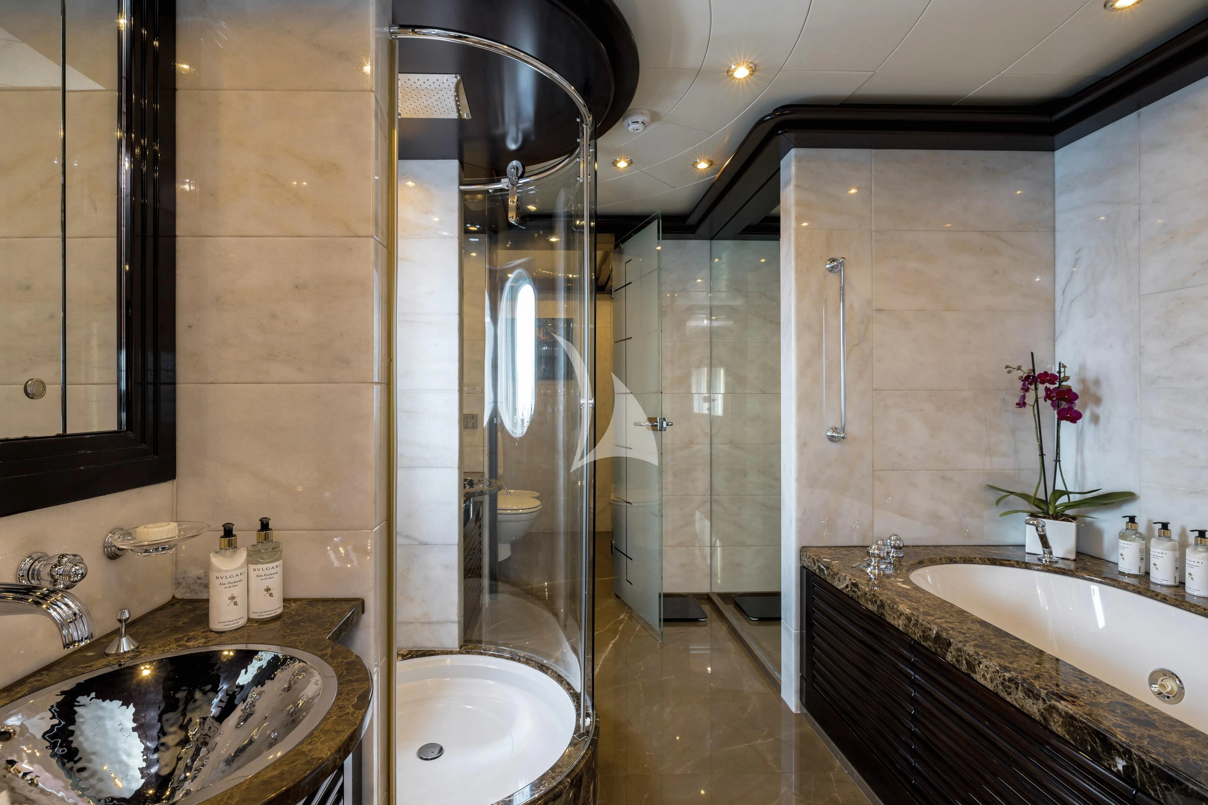 a bathroom with a glass shower aboard DREAM Yacht for Sale