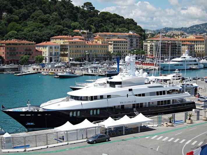 a large white boat in a harbor aboard DREAM Yacht for Sale