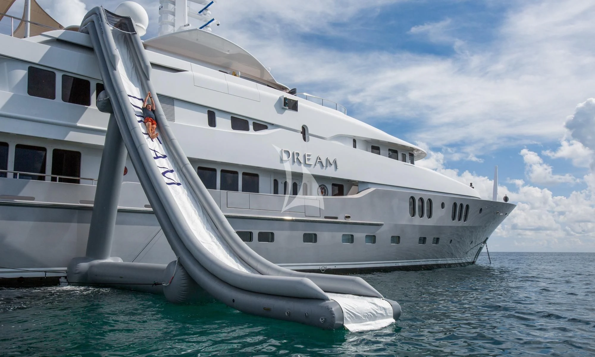 a white boat on the water aboard DREAM Yacht for Sale
