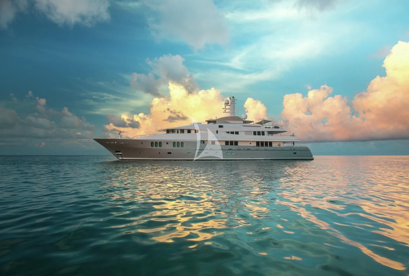 a white ship in the water aboard DREAM Yacht for Sale