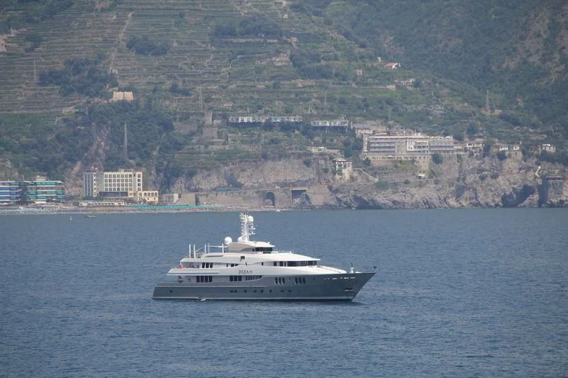a white boat on the water aboard DREAM Yacht for Sale