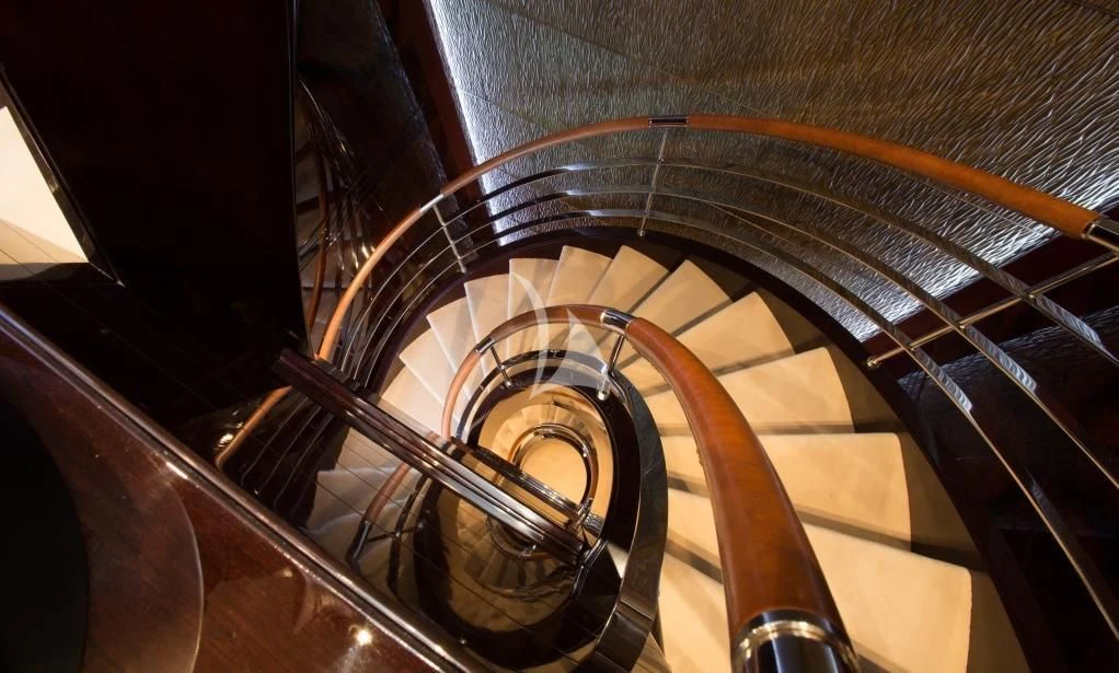a spiral staircase with a metal frame aboard DREAM Yacht for Sale
