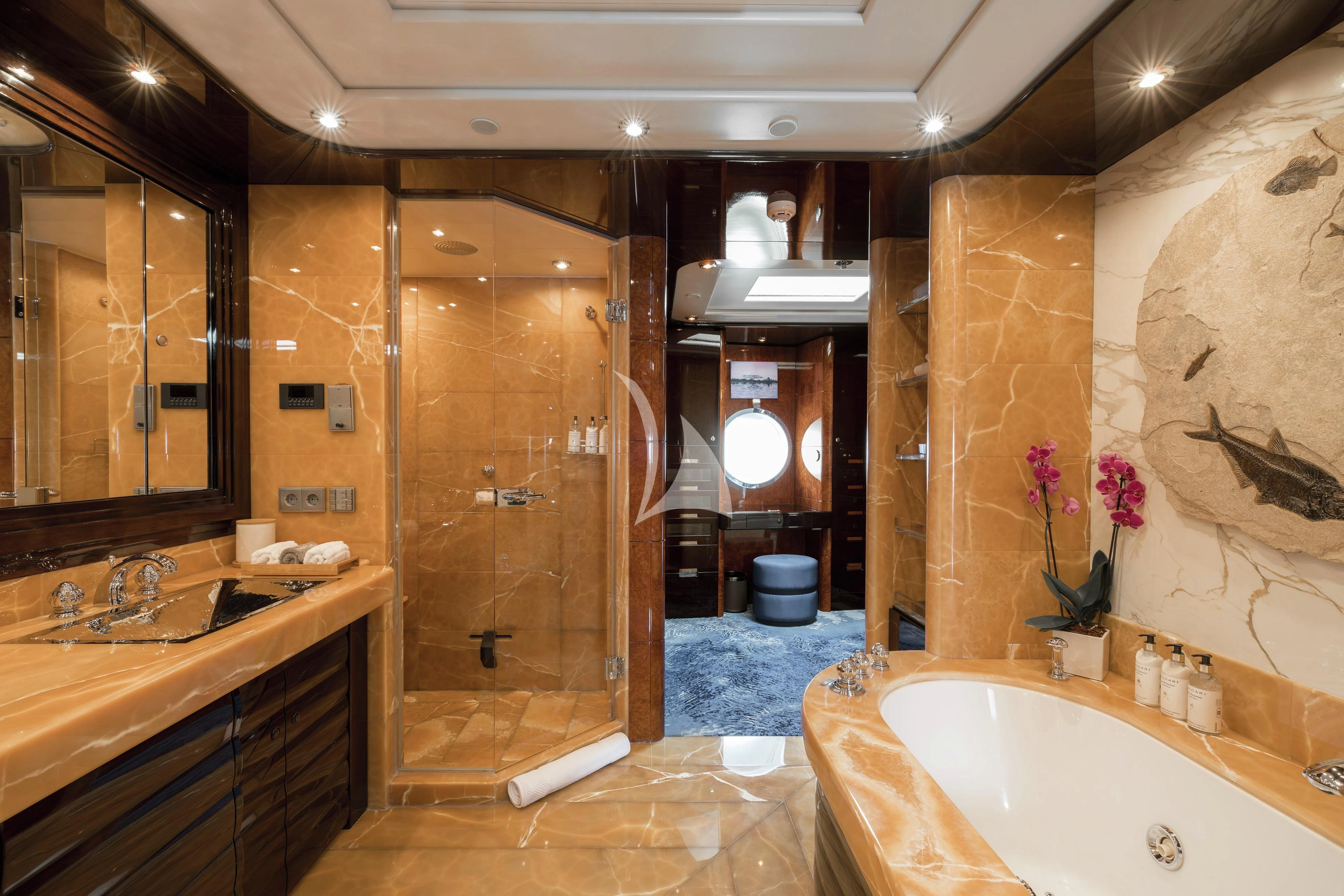 a bathroom with a tub and shower aboard DREAM Yacht for Sale