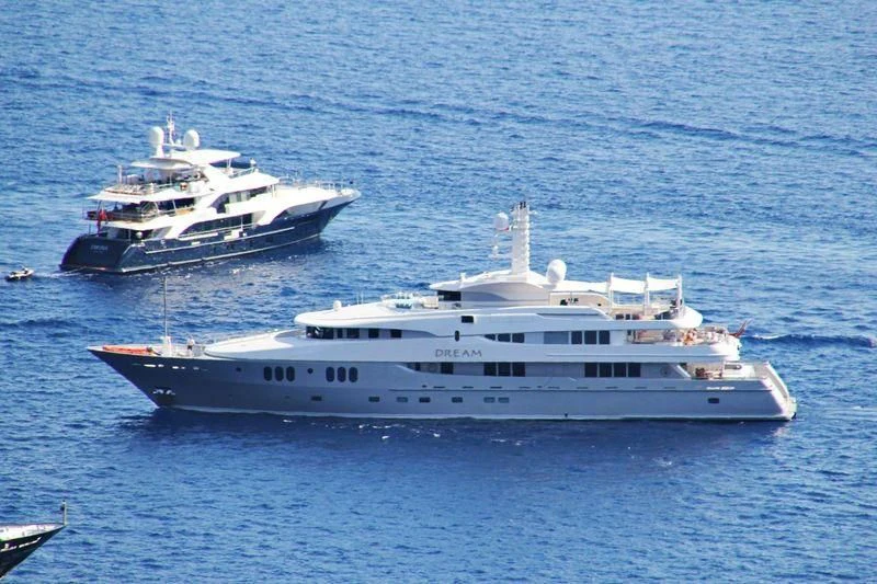 a couple of large white boats in the water aboard DREAM Yacht for Sale
