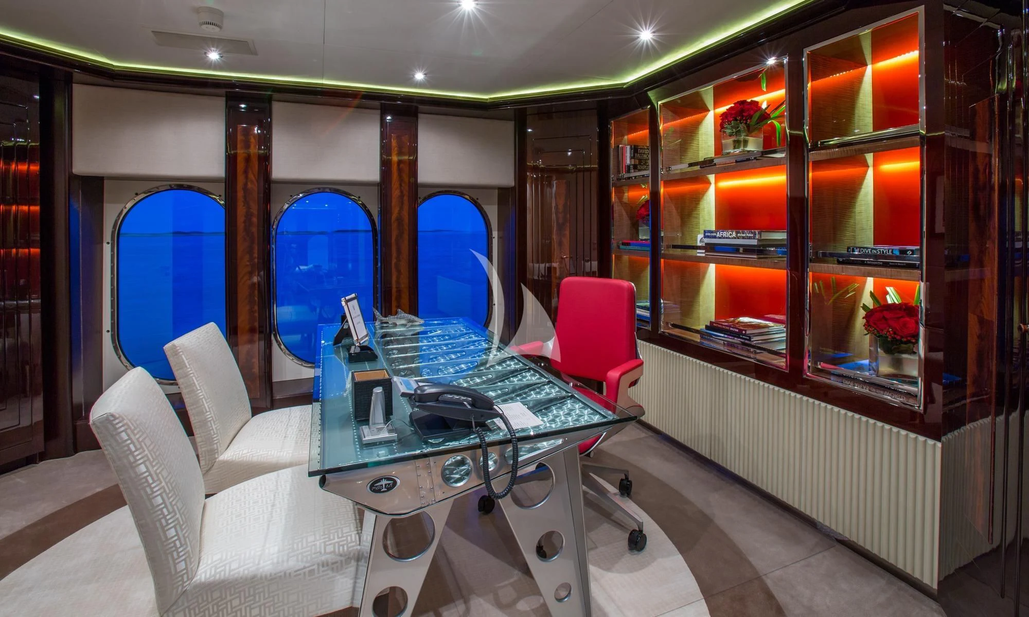 a room with a desk and chairs aboard DREAM Yacht for Sale
