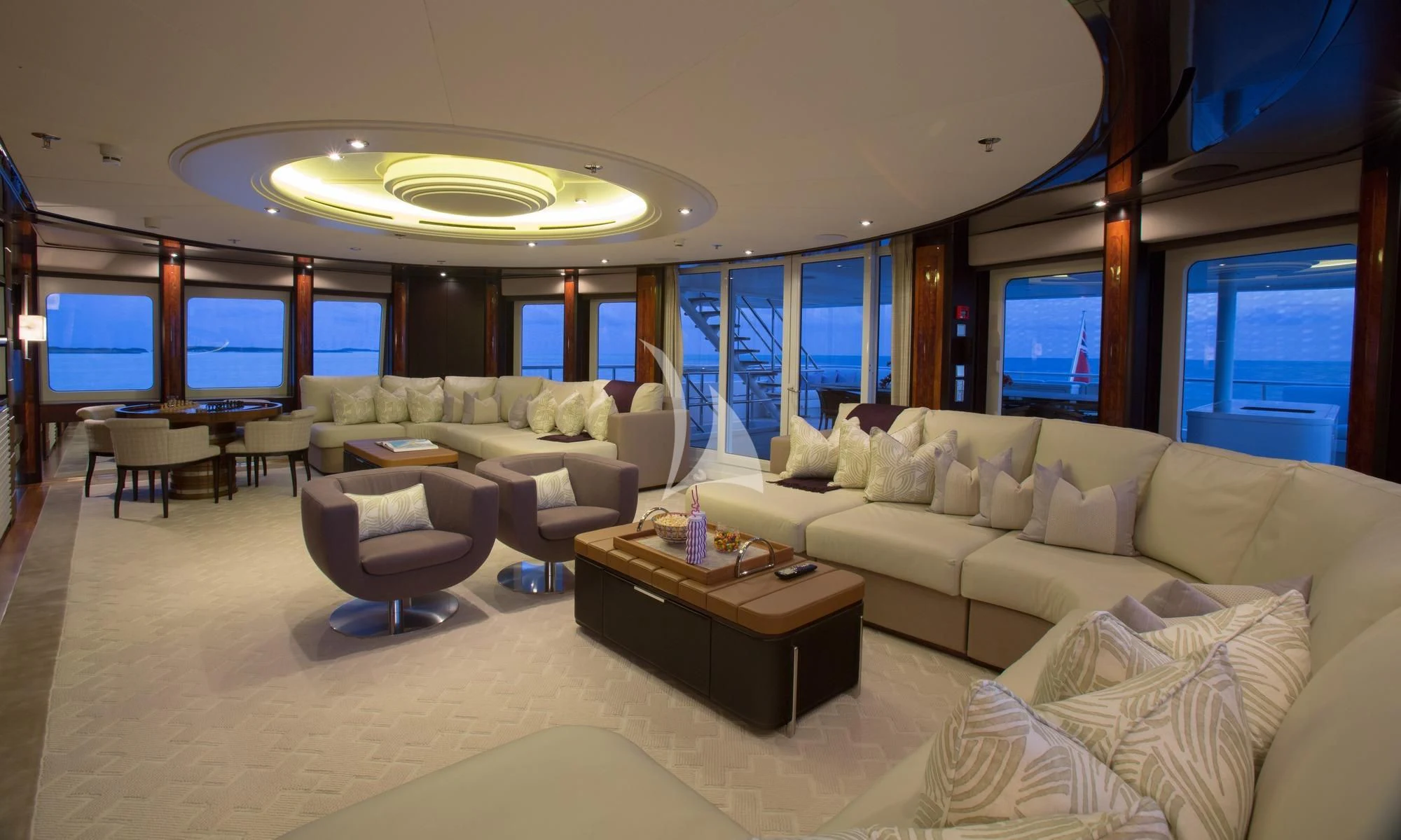 a living room with a large window aboard DREAM Yacht for Sale