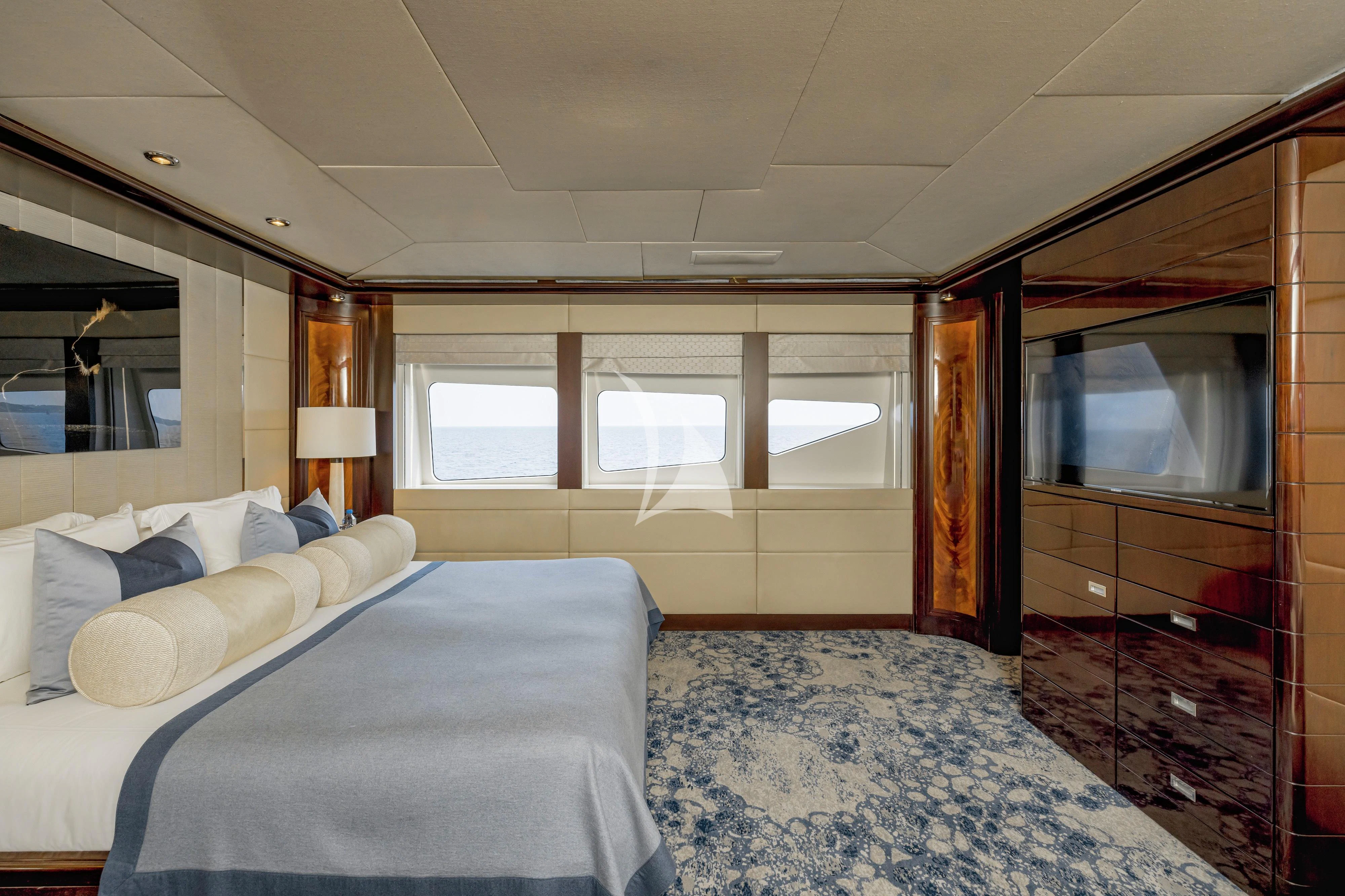 a bedroom with a large mirror aboard DREAM Yacht for Sale